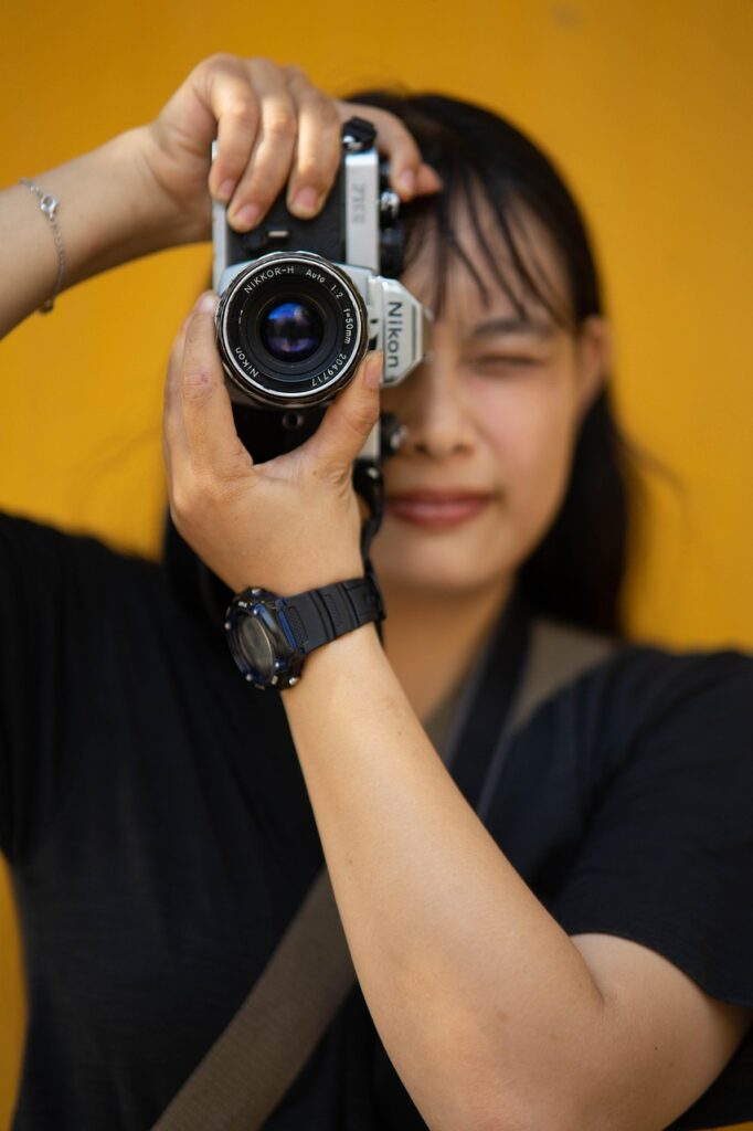 Woman with a camera taking a picture